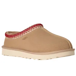 Tan suede slip-on shoe with a red-trimmed edge and a cream rubber sole. Brand logo is subtly embossed on the side.